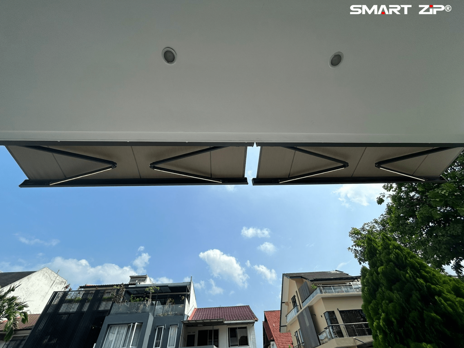 Completed retractable roofing over a Singapore car porch
