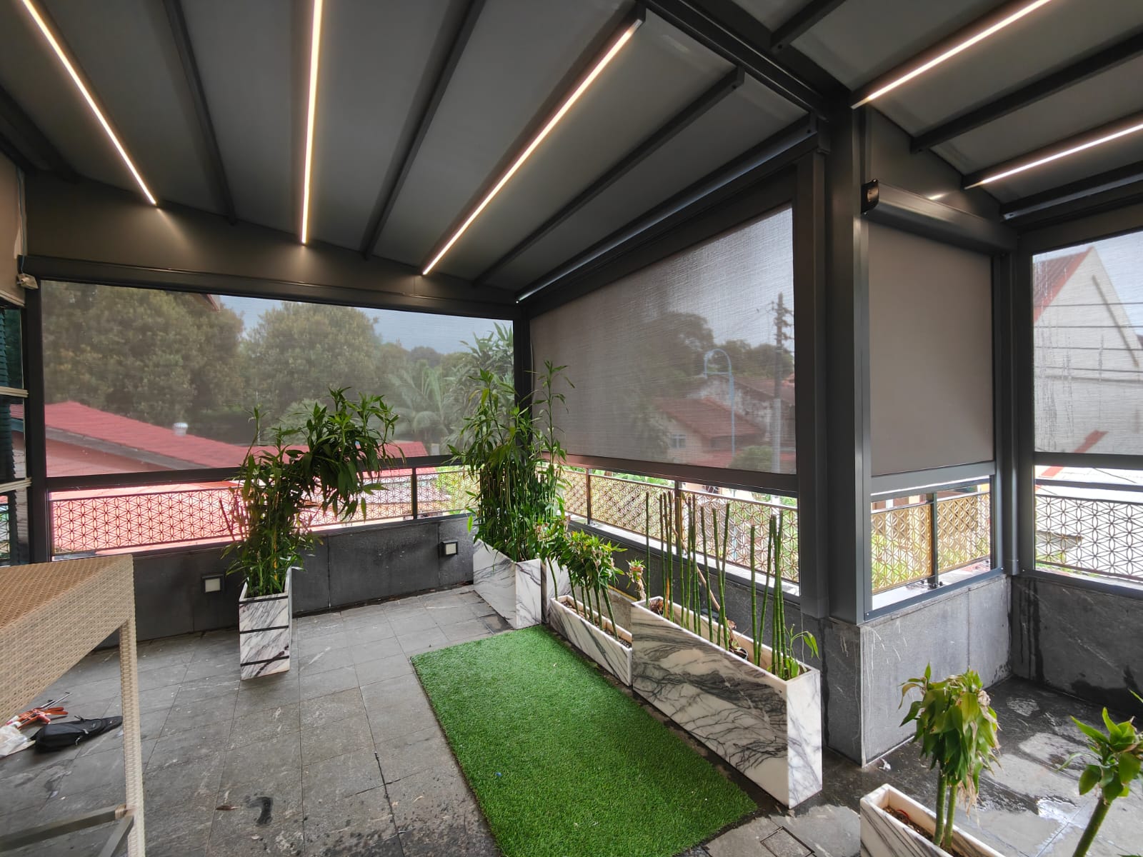 Covered rooftop pergola creating a sheltered outdoor living area
