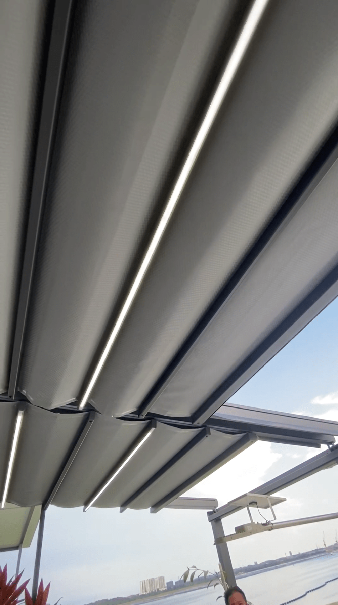 Adjustable pergola louvers demonstrating ventilation and shade control