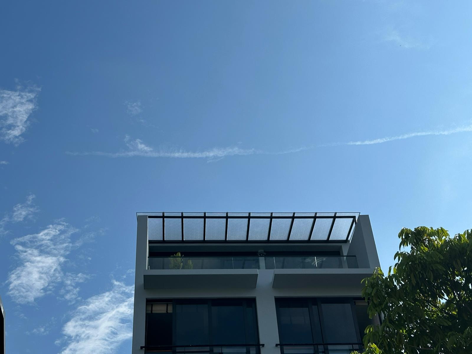 Completed exterior canopy extending from a modern Singapore home
