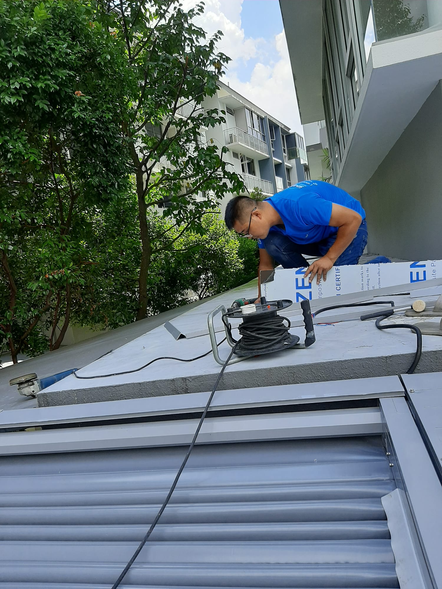 Technician carrying out pergola installation work on site