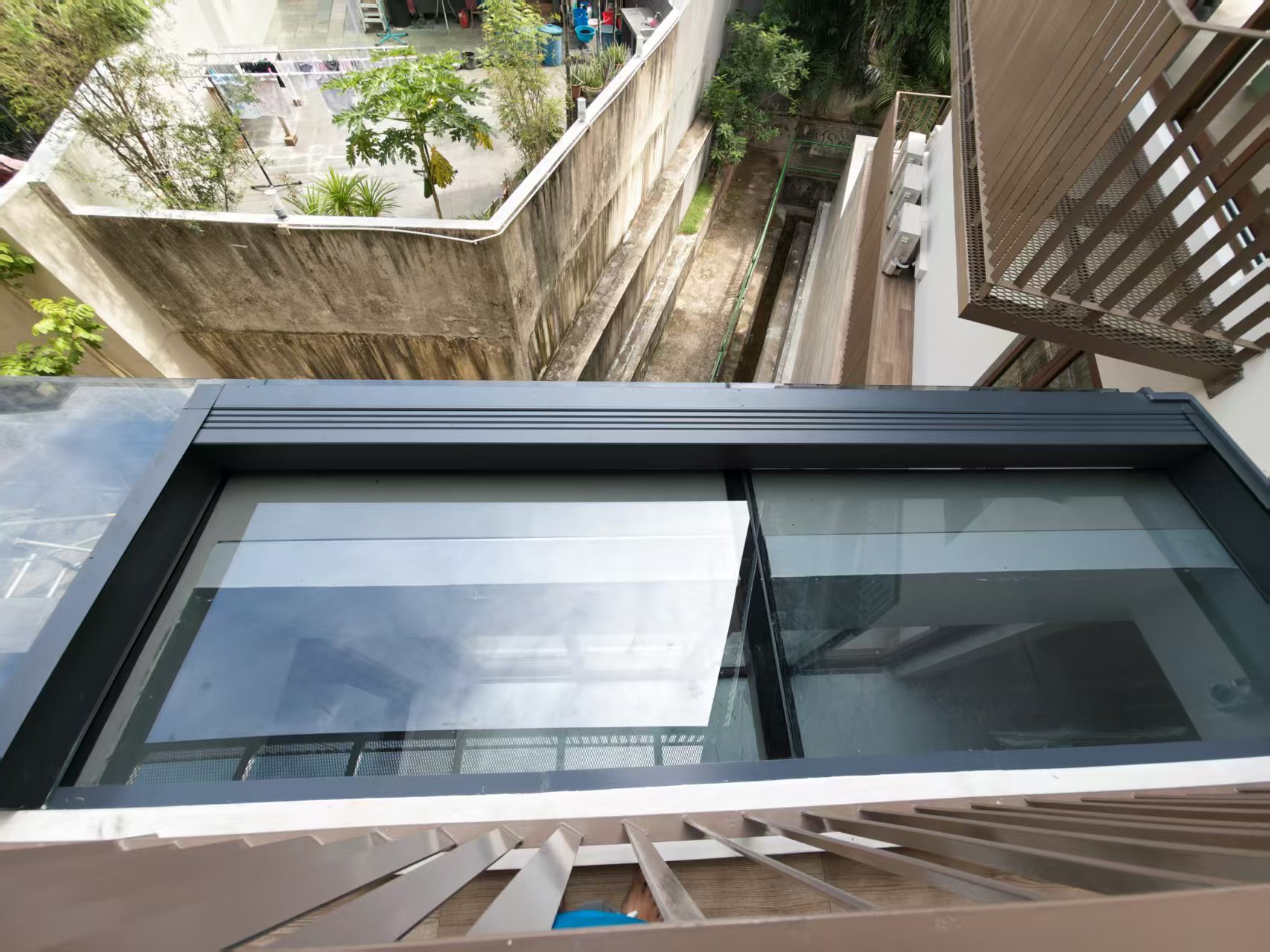Completed louvered pergola roof integrated with an urban home
