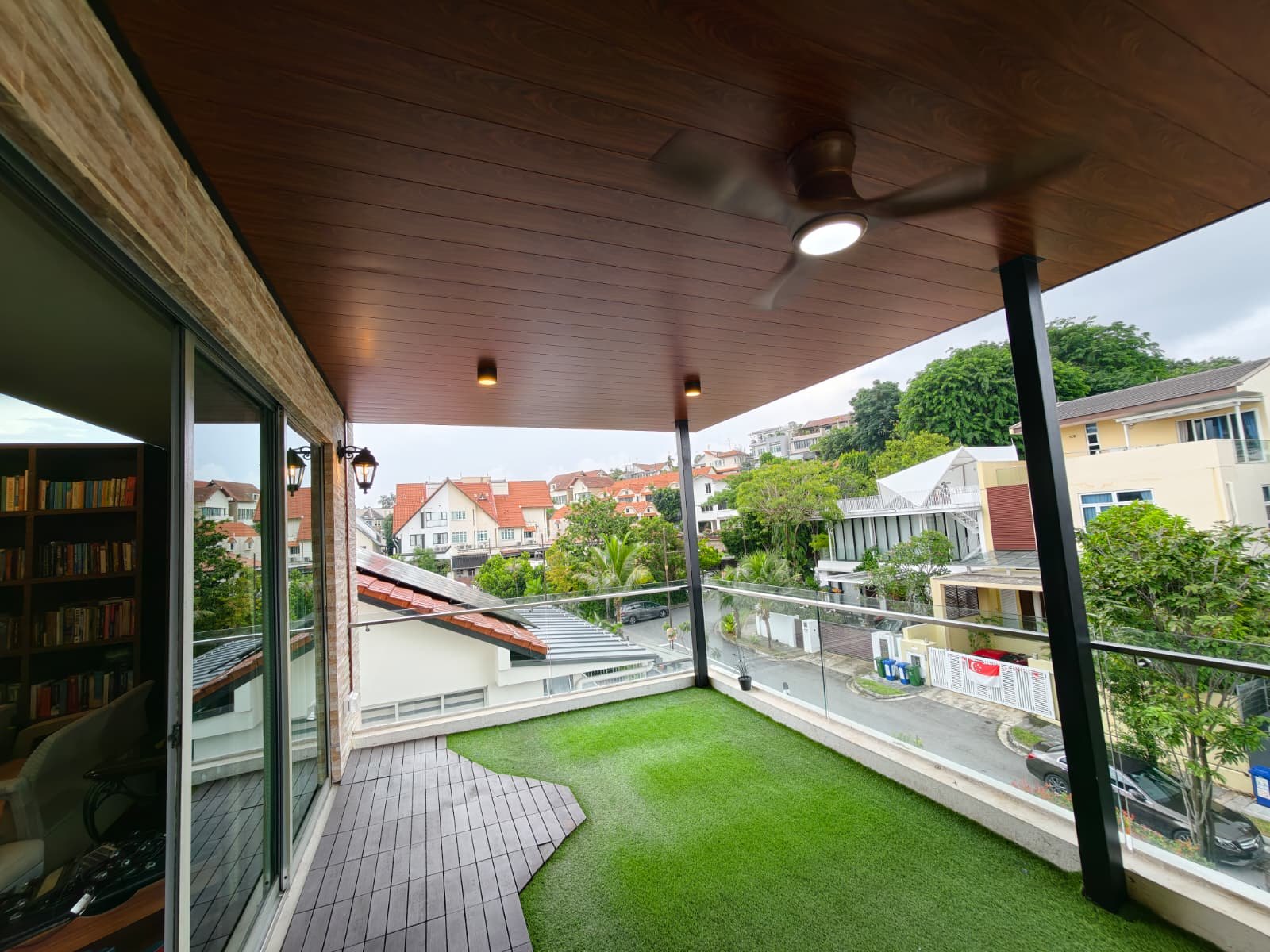 Timber-look ceiling above a covered balcony — aluminium ceiling panel