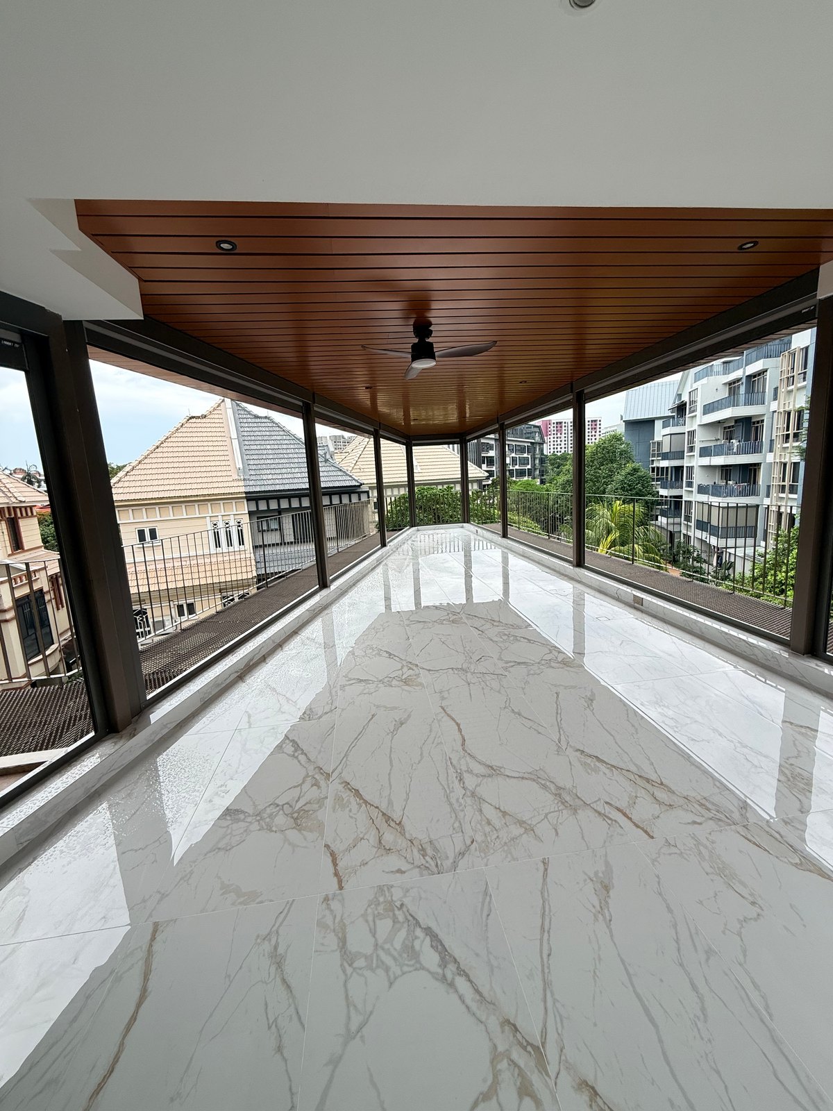 Long covered balcony showing ceiling and structural supports