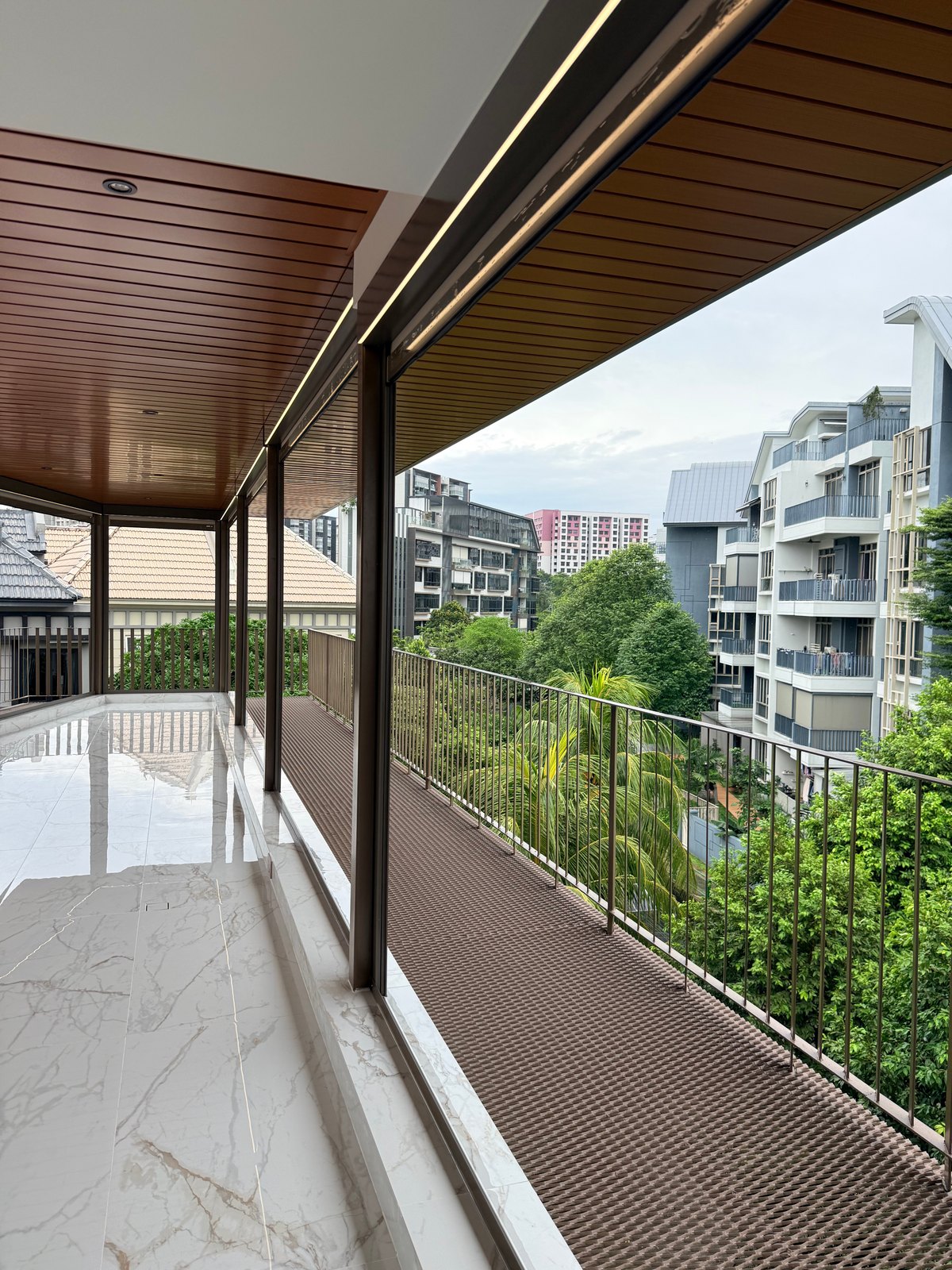 Ceiling panels running above a narrow balcony route