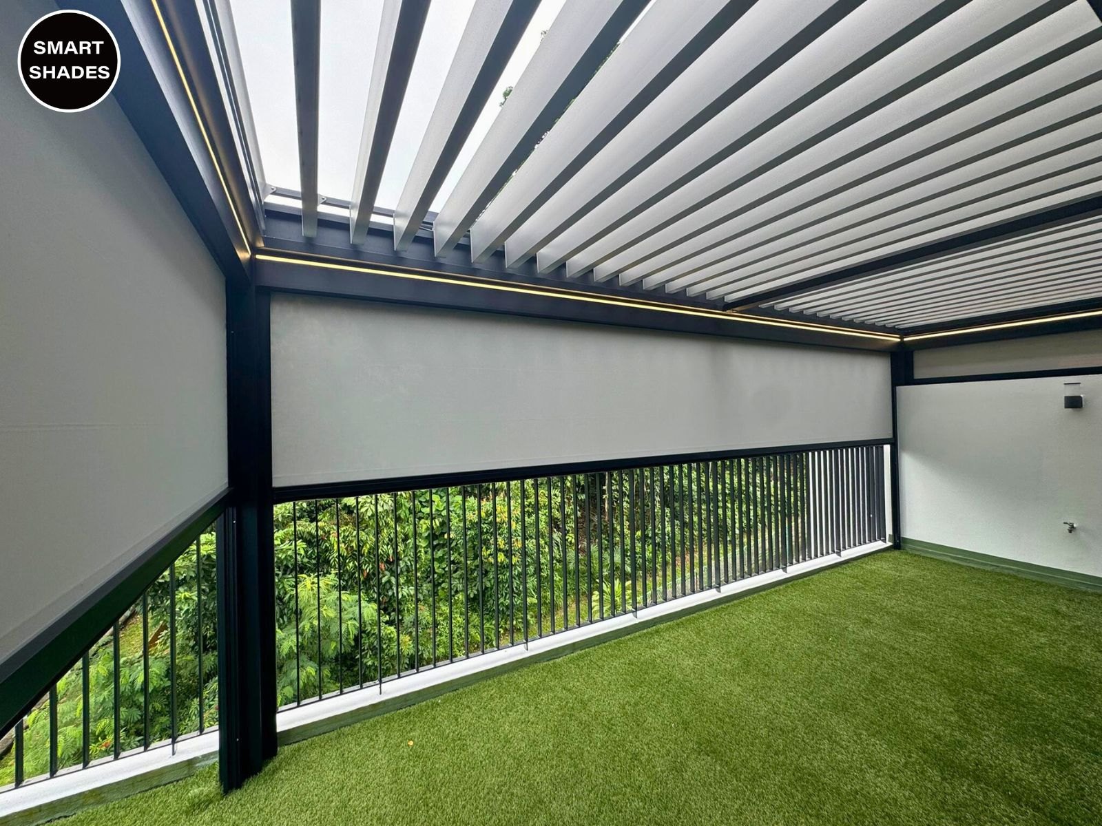 Louvred pergola roof above an outdoor area with side screens
