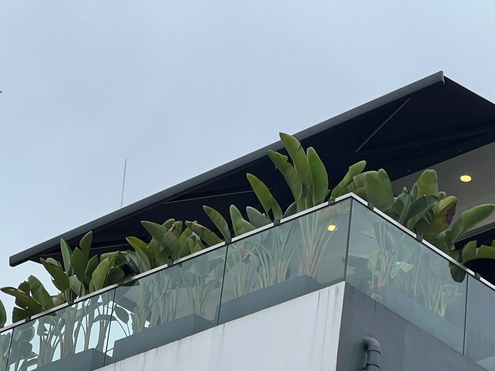Awning viewed from the edge of an upper terrace