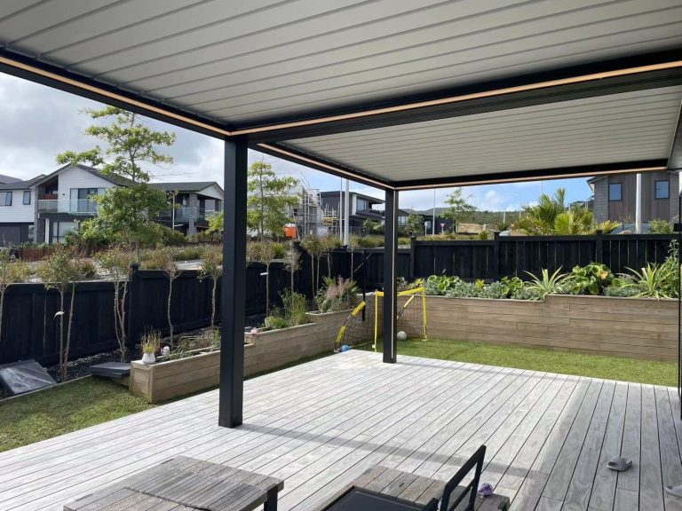 Pergola framing a garden deck beside a house — pergola