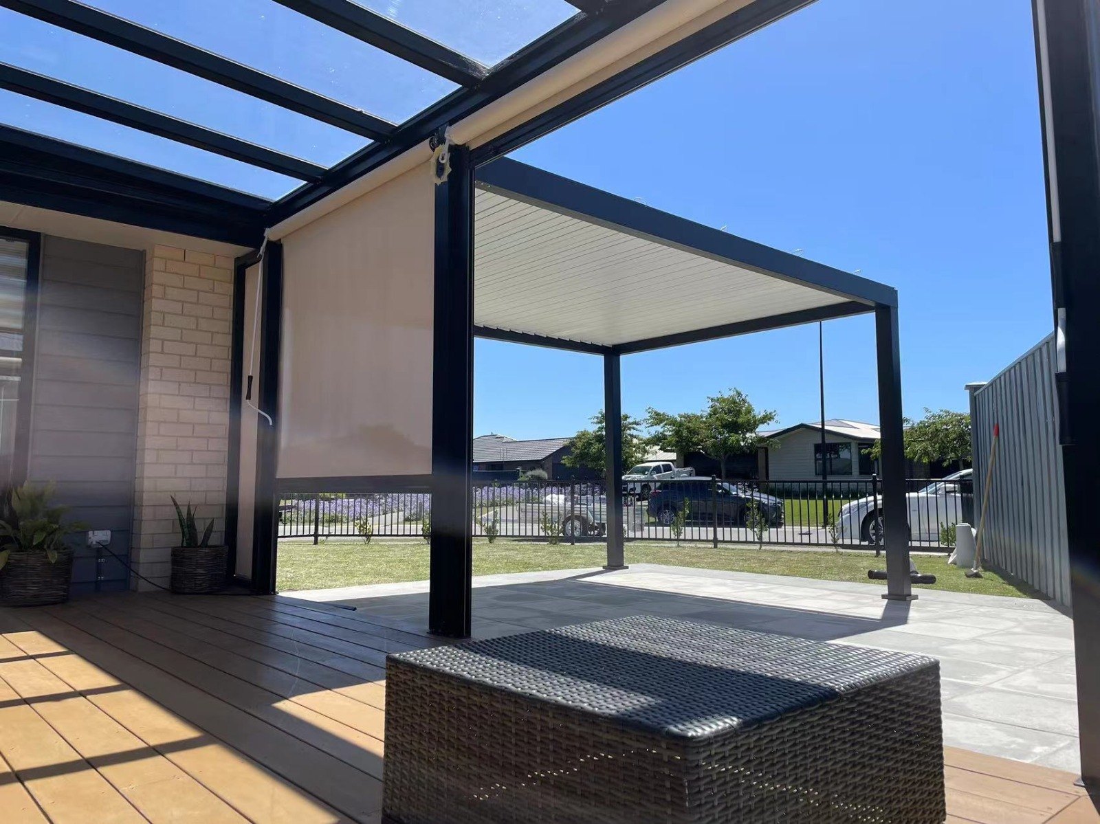 Pergola beams and posts framing an outdoor seating space