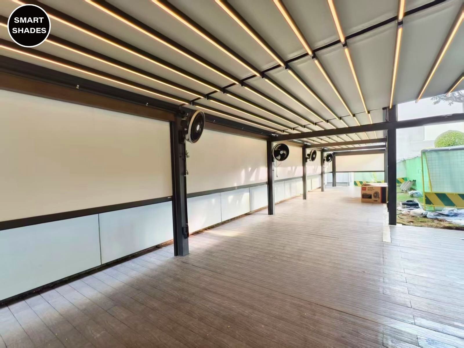 Long covered patio beneath a retractable pergola
